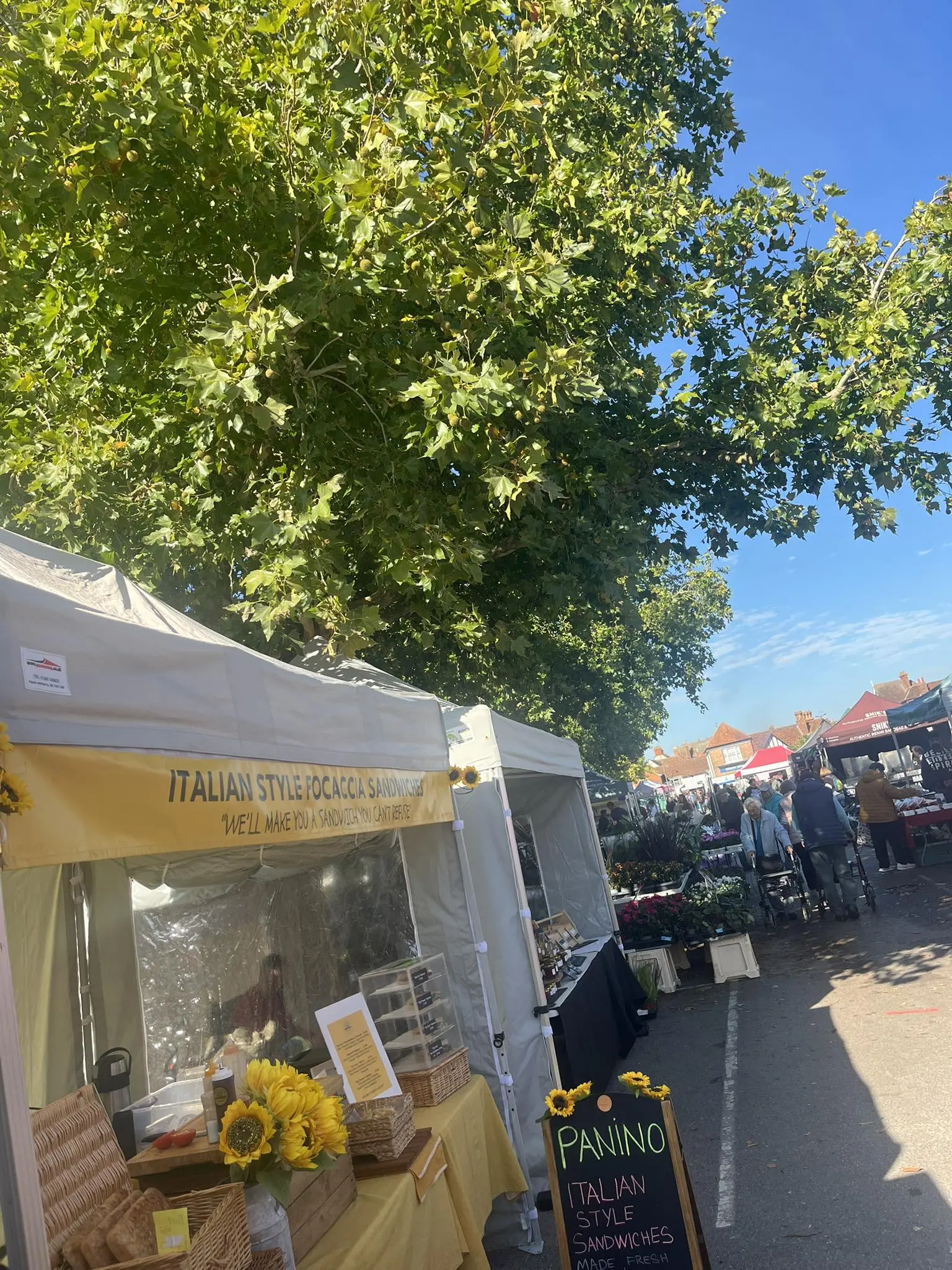 Panino Focacceria market stall with sunflowers